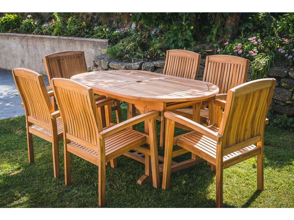 Teak Fixed Oval pedestal table With 6 stacking Charlotte chairs 