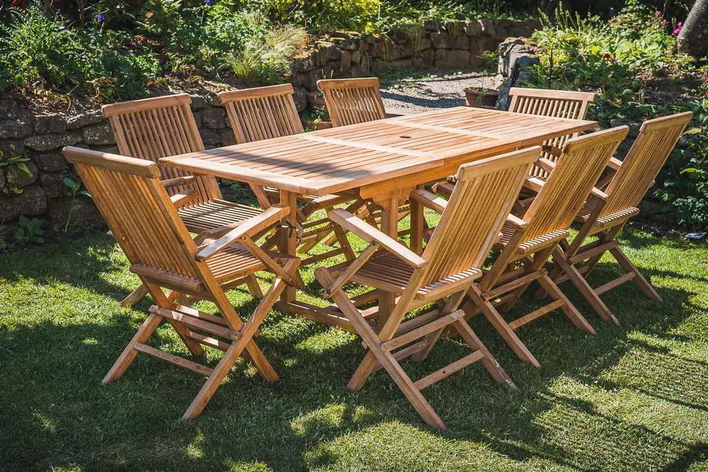 Solid Teak Rectangular Extending 1.5m – 2.1m Table and 8 Folding Armchairs Patio Set