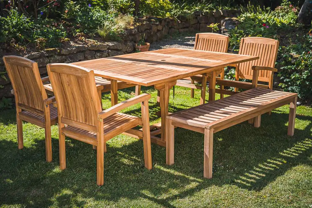 Solid Teak 10 Seater Extending 1.2m – 1.8m Table with 2 Backless Benches and 4 Charlotte Stacking Chairs